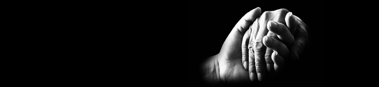 Close-up of young woman's and elderly woman's hands